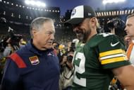 Head coach Bill Belichick of the New England Patriots and Aaron Rodgers #12 of the Green Bay Packers talk after Green Bay's 27-24 win in overtime at Lambeau Field on October 02, 2022